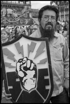 A fired worker holding the shield of his union, the SME.